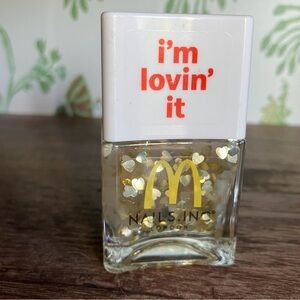 Nails Inc x McDonalds “I’m lovin’ it” gold heart glitter nail polish bottle